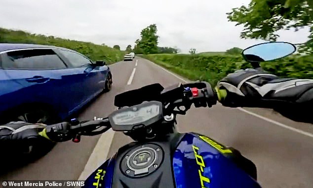 Males then audaciously overtakes three cars in one reckless manoeuvre before squeezing past a fourth on the inside