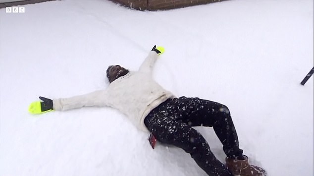 Some people were seen making the most of the wild weather as they made snow angels