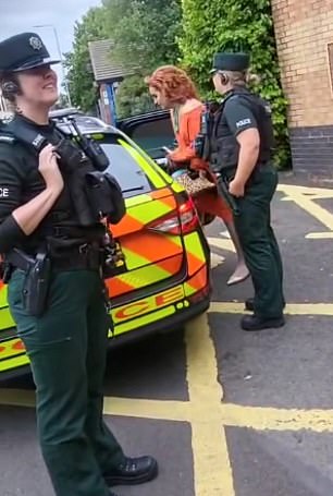 Police escort two drag artists away from Drag Queen Story Time at Holywood Arches Library in Belfast