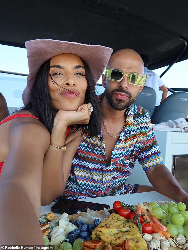 The pair were having the time of their lives on a boat trip
