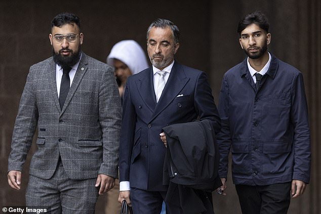Amaaz (right) and his brother Muhammad Amaad (left) will face a retrial on assaulting PC Zachary Marsden next year (pictured with lawyer Aamer Anwar)