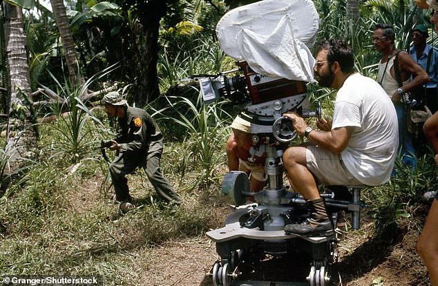 Coppola is pictured here directing 'Apocalypse Now' on location in the Philippines in 1979