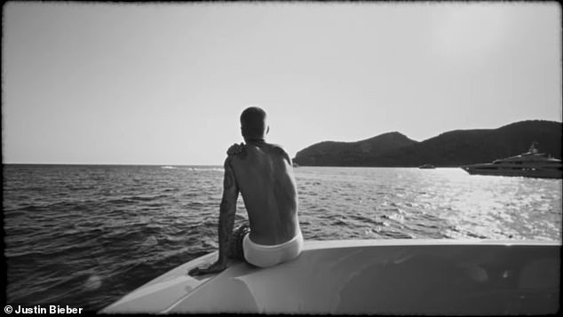 The new dad enjoys a moment of quiet as he gazes towards the water