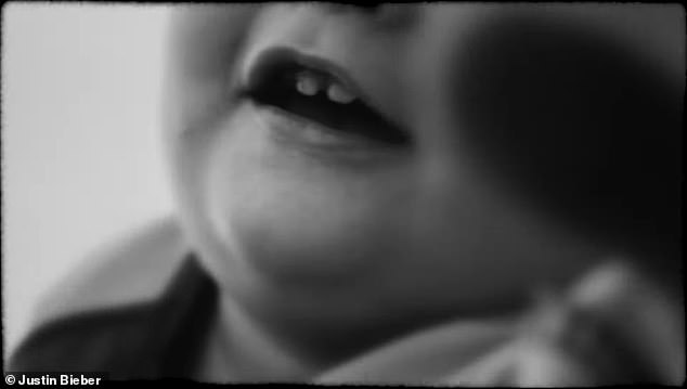 The youngster, who was born in August 2024, reveals his baby teeth