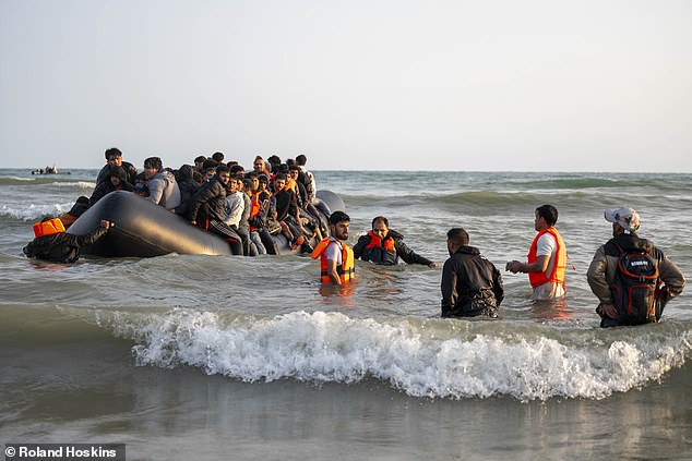 Four separate groups of migrants ran on to the sweeping sands at Gravelines, near Calais, just after 7am