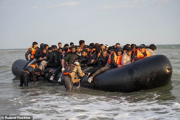 Police on the beach simply watched as the largest of the migrant groups, on the east end of the beach, patiently awaited the first of two taxi boats