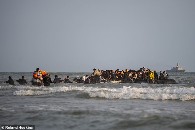 French police today held back from firing tear gas, probably because it would have instantly dispersed in the brisk winds coming in from the sea, and the migrants were anyway dispersed over such a wide area