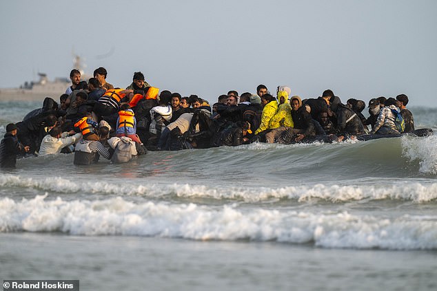 It soon became obvious it was a hopeless police effort, when the migrants suddenly emerged either side of the officers, in their four separate groups