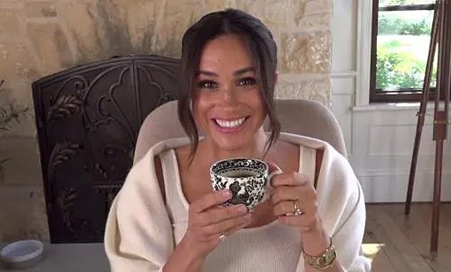 Meghan drinking a cup of tea at her home in Montecito. A royal author claimed that Meghan allegedly 'threw a cup of tea into the air' during a dramatic outburst on the tour