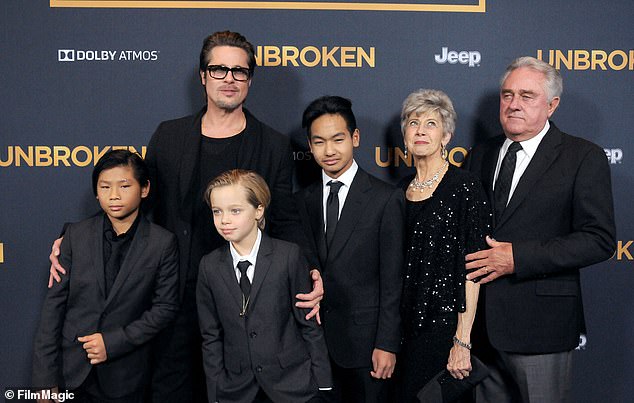 Jane is pictured 2014 with grandchildren Pax, Shiloh and Maddox