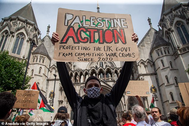 Pro-Palestinian activists stage a solidarity protest outside Royal Courts of Justice as co-founder of Palestine Action Huda Ammori takes Home Secretary to High Court over proscription of the group as terror organization in London, United Kingdom on July 4, 2025.