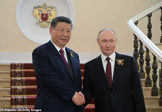 Putin with Chinese president Xi Jinping. It is claimed that Moscow and Beijing have been working together to weaken Western nations while maintaining ¿plausible deniability¿