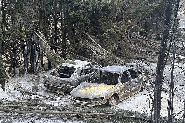 Cars are charred after a wildfire broke out near near Durban-Corbieres in southern France, Wednesday, Aug. 6, 2025