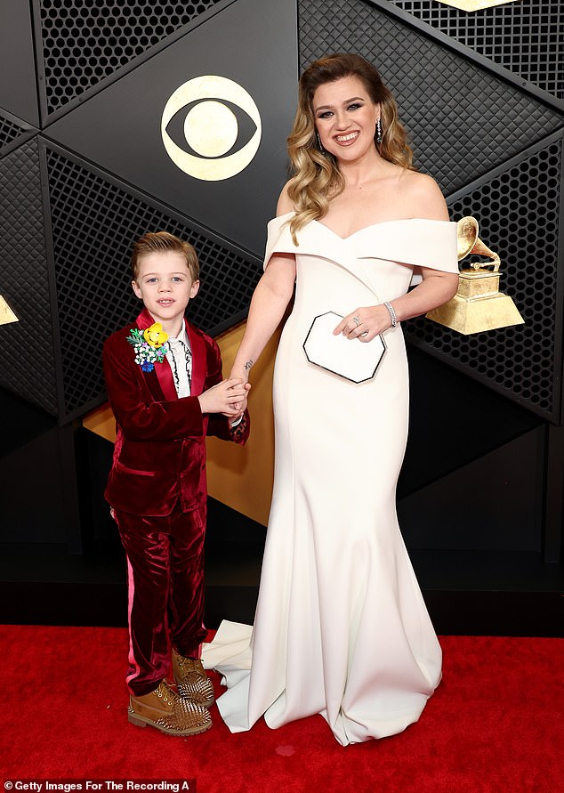 Earlier this year, Clarkson complained on Kylie Kelcie's Not Gonna Lie podcast that her children were 'innately' more accommodating to Blackstock's busy schedule, but not hers; pictured with Remington in February 2024 in LA