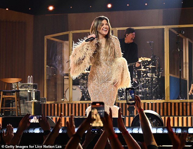 Sources previously claimed that Clarkson is unhappy with her talk show, but she may remain on it as a backup if her next album fails to sell well; pictured July 11 in Las Vegas