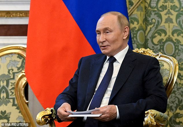 Russian President Vladimir Putin meets with Malaysia's King Sultan Ibrahim at the Kremlin in Moscow, Russia August 6