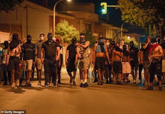 The crowd that gathered on July 14 reportedly chased peopled they suspected to be immigrants and clashed with members of Spain's Guardia Civil