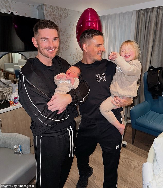 The couple, who have been together for 14 years, shared that their five-year surrogacy journey has been a success (Adam and Jamie pictured with their Goddaughters, Charlotte Crosby¿s children)