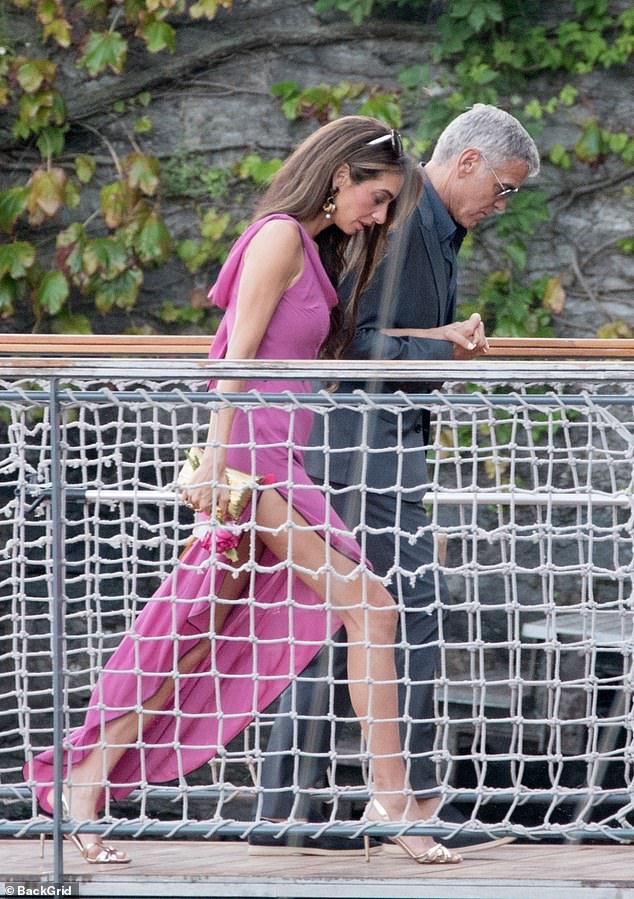Meanwhile George put on a dapper display in a sharp grey suit and aviator sunglasses as they headed out arm-in-arm together