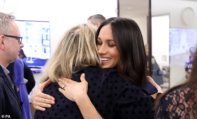 'She gave me a big old bear hug, the kind that makes you feel at ease – particularly when you are being presented to assorted royals in front of a bank of baying photographers,' Bryony writes