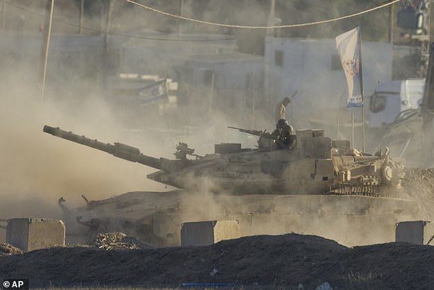 An Israeli tank moves near the border of the Gaza Strip in southern Israel, Wednesday, August 6, 2025