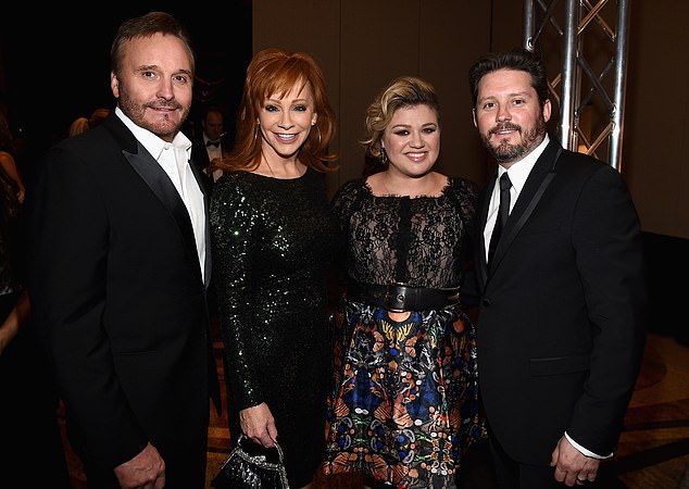 Blackstock's father, film producer Narvel Blackstock was married to McEntire from 1989-2015 and they share son Shelby, 35 - pictured 2015