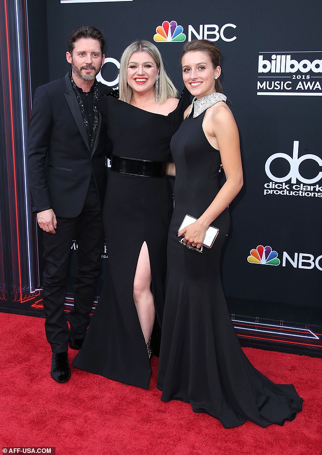In a photo posted on July 20, 18 days before Blackstock's death was announced, the frail star embraced his pregnant firstborn Savannah, 23; Blackstock seen with Clarkson and daughter Savannah in 2018