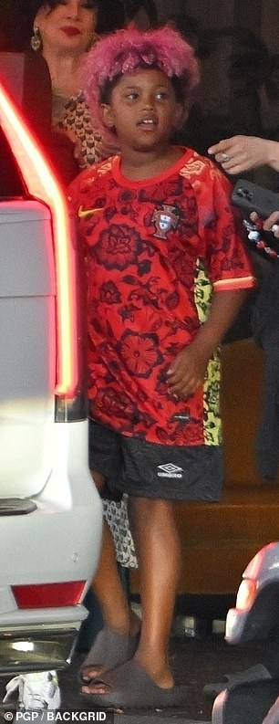 Saint sported a Nike red floral soccer jersey with his pink-hued hair