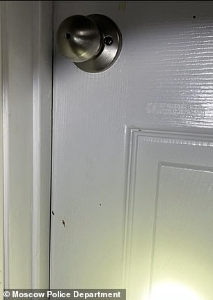 Blood spatters are visible on the white painted doors inside 1122 King Road in Moscow, Idaho