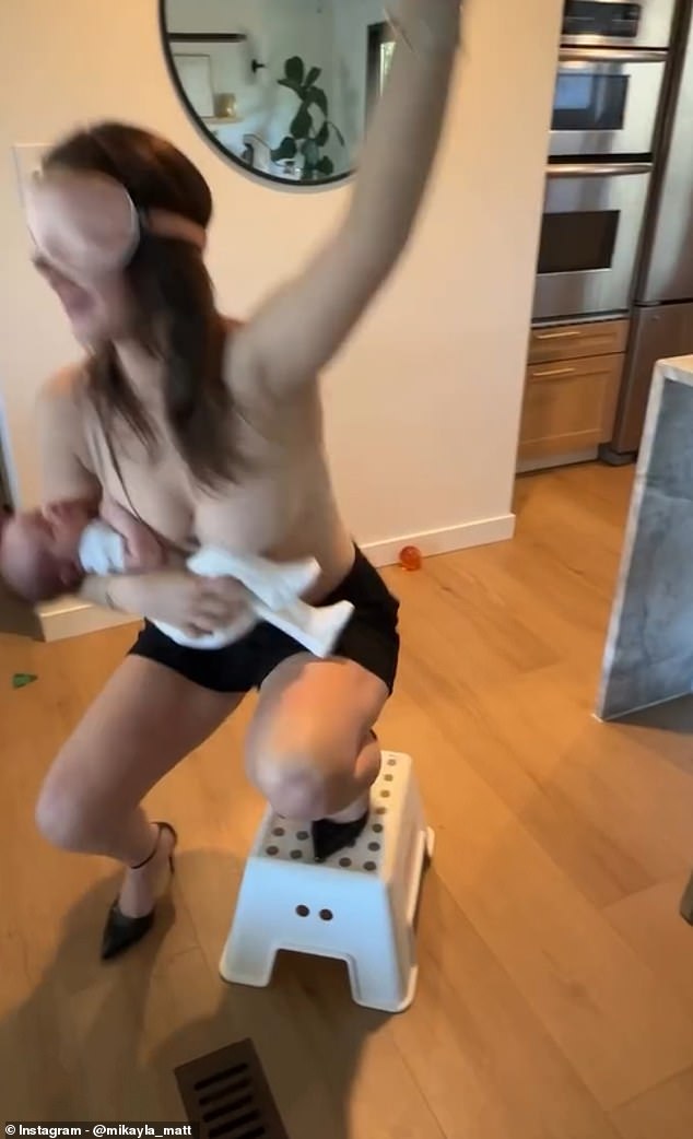 Mikayla loses her footing and comes off the platform - but her baby remains in her arms