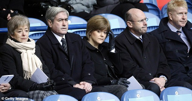 Ms Sturgeon said she was 'desolate and heartbroken' after losing her baby in 2010 and confessed she new she would never have another opportunity to become a mother (Pictured at a memorial service for the Ibrox disaster days after her miscarriage)