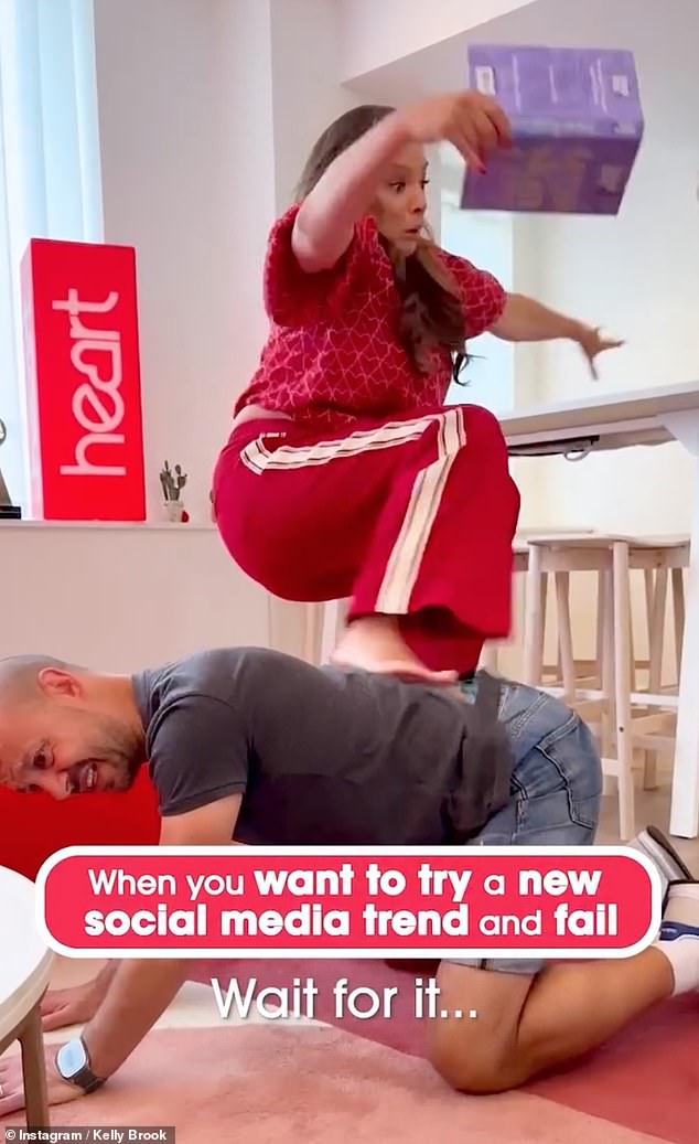 The Heart FM presenter, 45, channelled Nicki Minaj 's famous 2013 High School music video pose where she balances in stilettos by a pool Donning a red tracksuit and bare feet