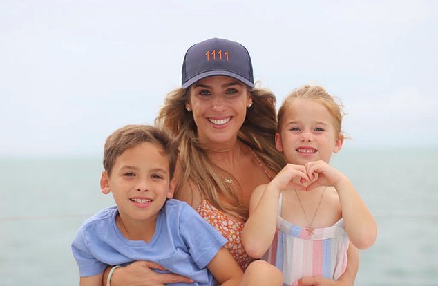 Hillsberg with her children, now nine and six, wearing a baseball cap with the numerals 1111 which are so meaningful to them after Dave's death