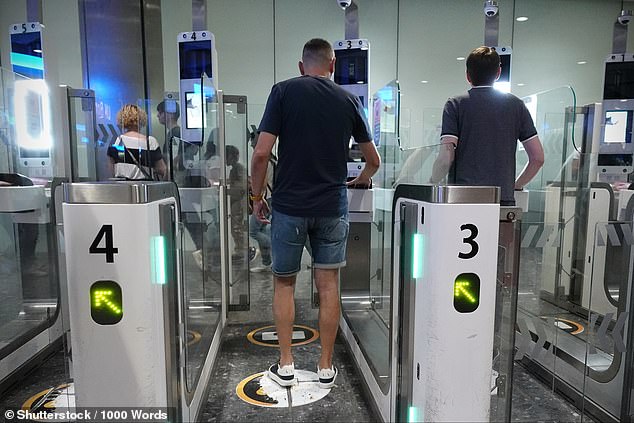 Strict new border regulations mean Brits travelling to Europe will soon need to prove they have medical insurance and a return ticket, The Times reports. Pictured: Air travellers pass through automated passport border control e-gates at Heathrow Airport on August 2, 2024
