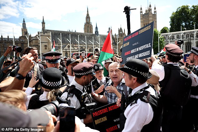During a day of chaos and farce, Left-wing activists swamped Parliament Square in London on Saturday in support of the organisation, which was proscribed by the Government last month as a terrorist group
