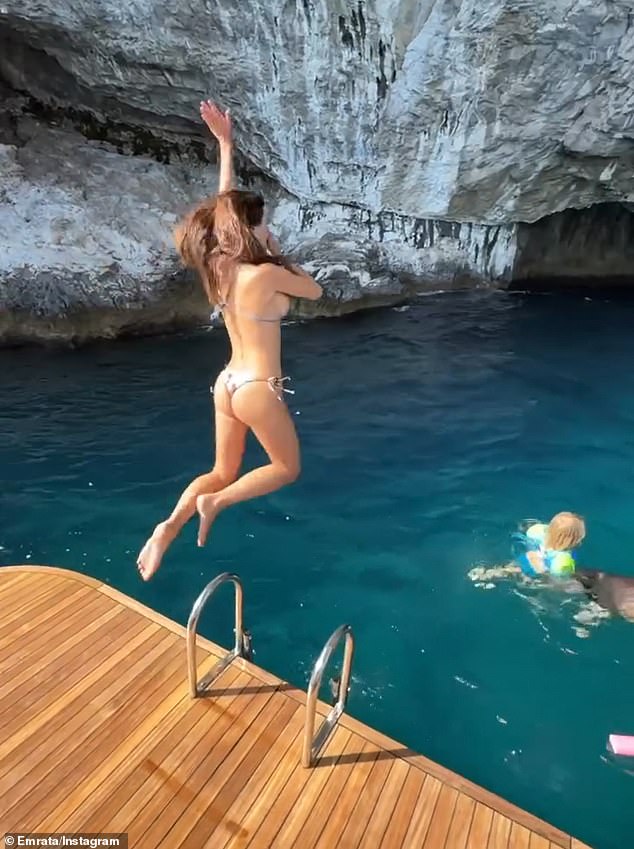 In the video, she was seen leaping into the clear, blue waters where her son and a friend were swimming