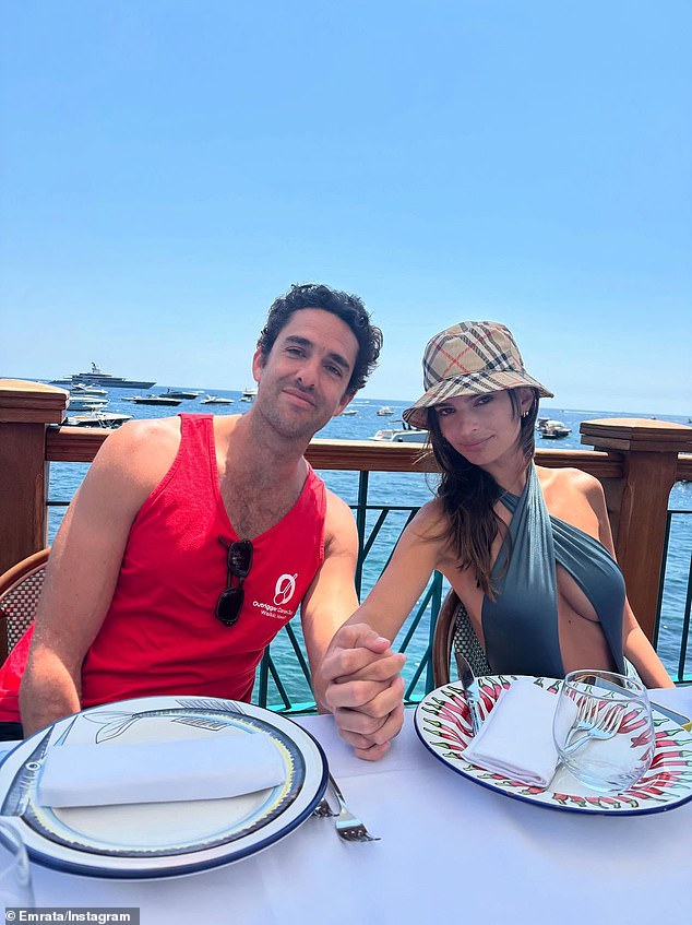 In one particular photo, she was also seen with her hands intertwined with her friend as they sat at the outdoor dinner table together
