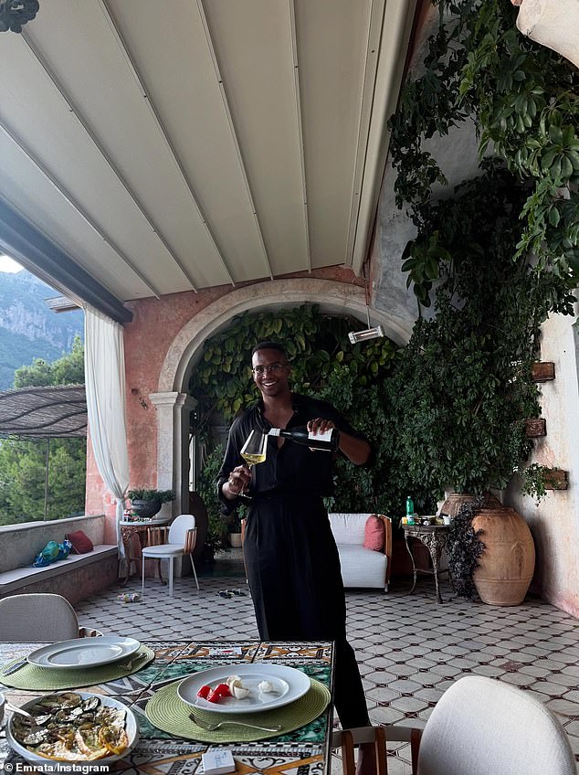 The model also posted a snapshot of her friend pouring a glass of white wine on a patio with a view