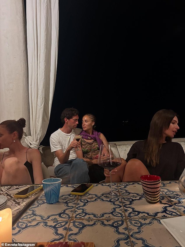 Ratajkowski also posted a candid snapshot of her and her friends enjoying red wine and conversation on a patio together