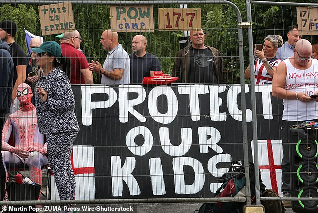 It's believed around one in eight prisoners in England and Wales are foreign-born, costing taxpayers about £580million a year (pictured are protesters in Epping on July 27)