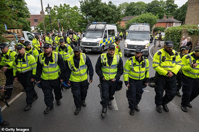 Anger continues to build across Britain over the number of illegal migrants allegedly carrying out crimes after arriving in the UK (pictured are police in Epping, Essex, during a protest after an asylum seeker living in a migrant hotel allegedly sexually assaulted two teenage girls)
