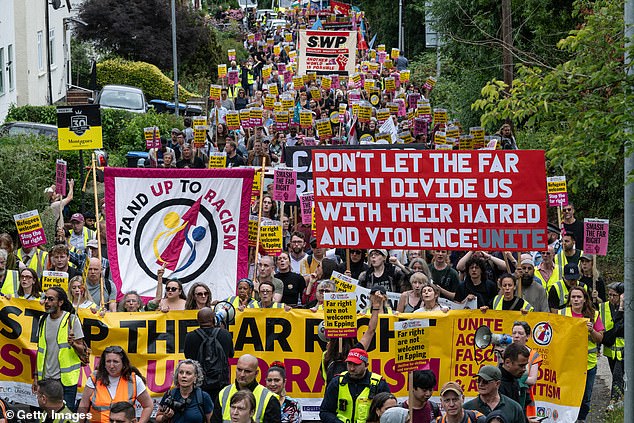 Large scale counter-protests have also taken place. Pictured are activists marching in Epping on July 27