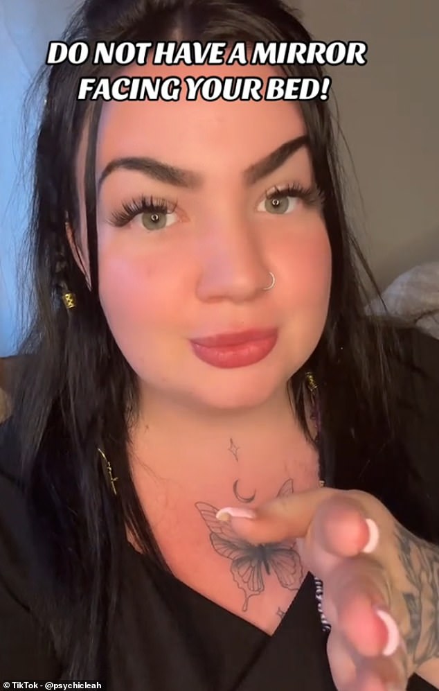 UK-based Leah (pictured), who describes herself as a 'psychic medium', has warned viewers against having a mirror facing their bed, claiming that it could bring 'unwanted spirits' into the home