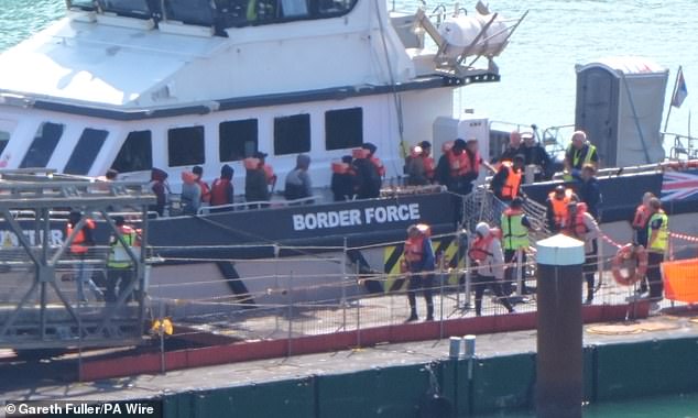 A group of people thought to be migrants are brought in to the Border Force compound in Dover, Kent, from a Border Force vessel following a small boat incident in the Channel on August 10, 2025