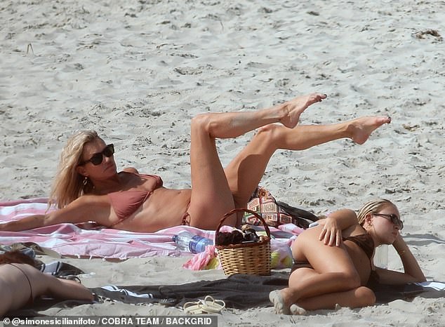 Lila slipped into a brown bikini as she and her mother sunbathed together
