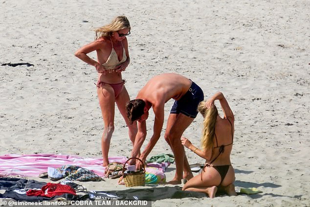 The pair slipped into revealing bikinis as they relaxed alongside Lila's boyfriend Yoni Helbitz