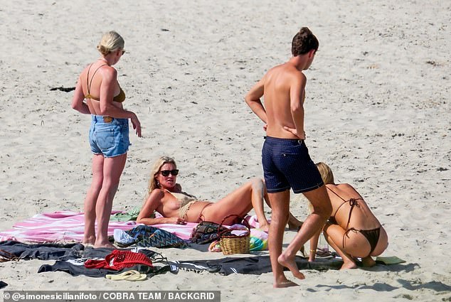 Kate's beach babe look saw her go make-up free and showcase her smooth visage, which has left tongues wagging over the years about possible cosmetic work