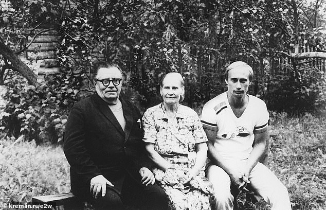 Vladimir Putin pictured with his parents Vladimir and Maria before leaving USSR to the German Democratic Republic