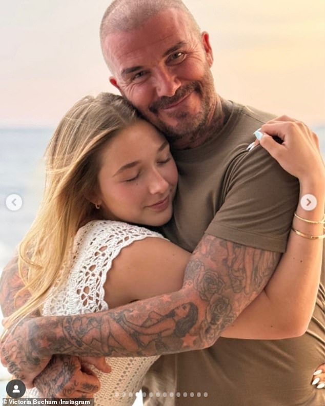 Proud dad David also beamed with pride while hugging his daughter Harper, 14, as the sun set behind them