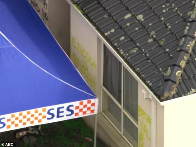 Sinister graffiti was also found scrawled outside the Mount Waverley unit where the couple were allegedly murdered, as homicide detectives scoured the scene on Tuesday